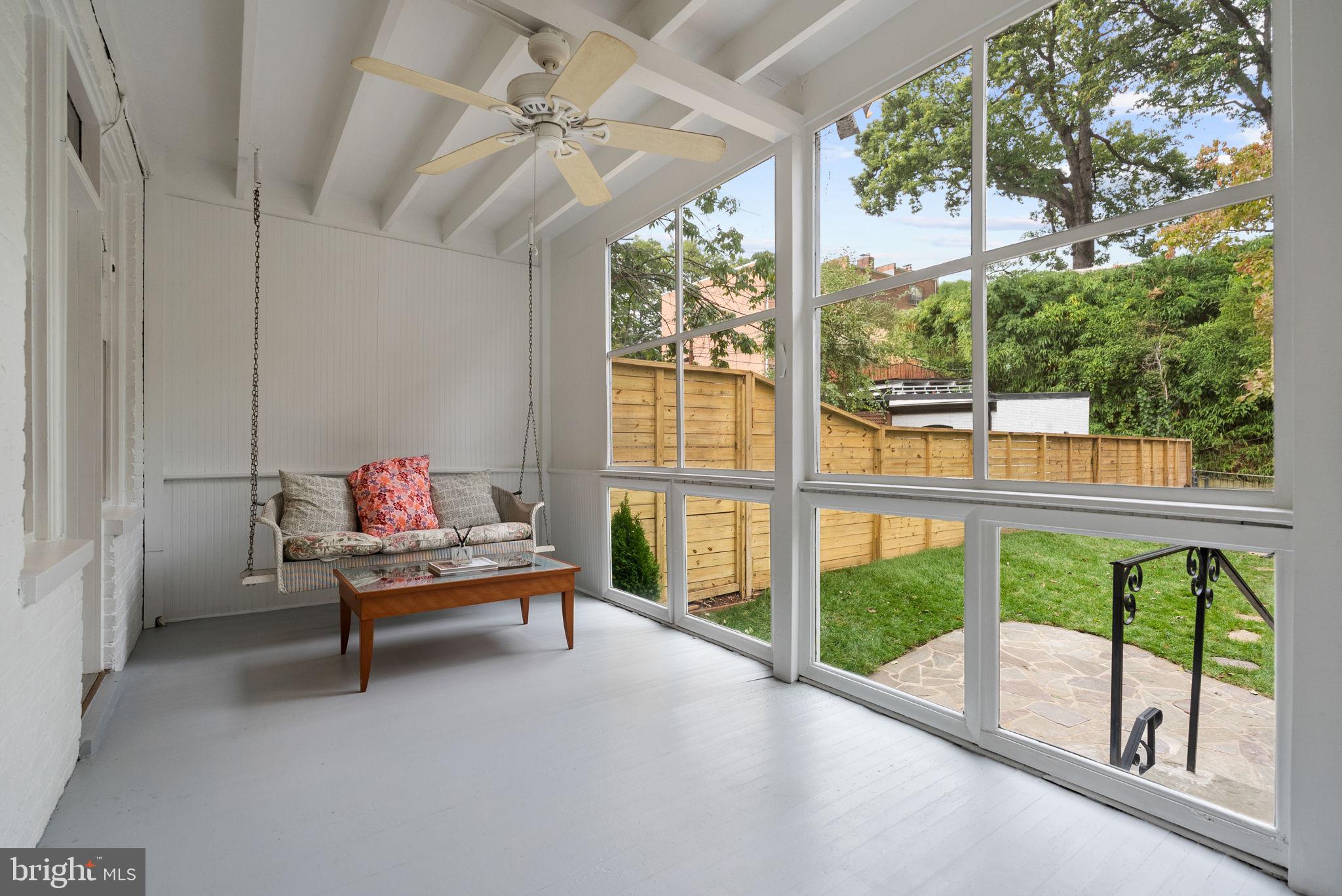 3819 T Street Northwest Washington, DC 20007 - Photo 8 of 27 a view of a porch with furniture and a yard
