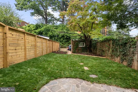a backyard of a house with lots of green space