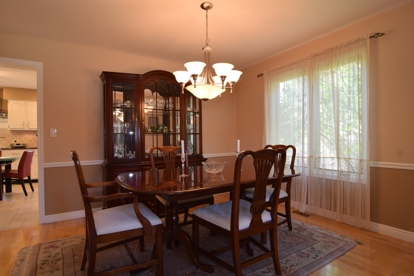1268 Itasca Road Addison, IL 60101 - Photo 8 of 26 a view of a dining room with furniture window and wooden floor