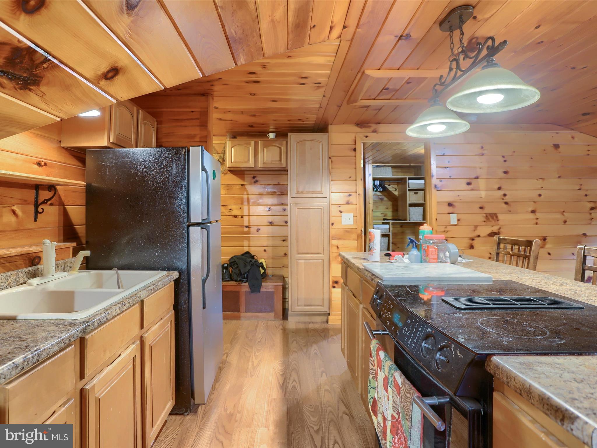 389 Church Road Shermans Dale, PA 17090 - Photo 49 of 85 a kitchen with stainless steel appliances granite countertop a sink stove and refrigerator