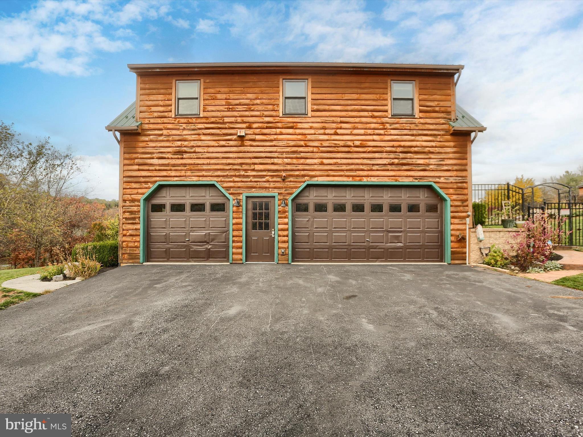 389 Church Road Shermans Dale, PA 17090 - Photo 5 of 88 a front view of a house with a yard and garage