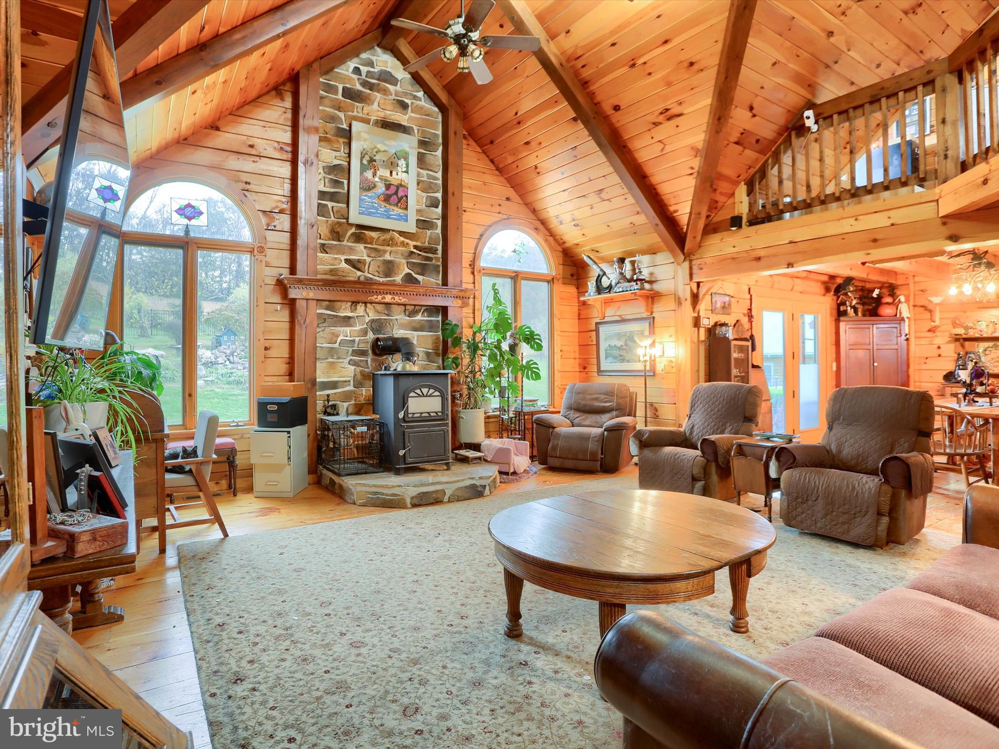 389 Church Road Shermans Dale, PA 17090 - Photo 7 of 85 a outdoor living area with furniture and a large window