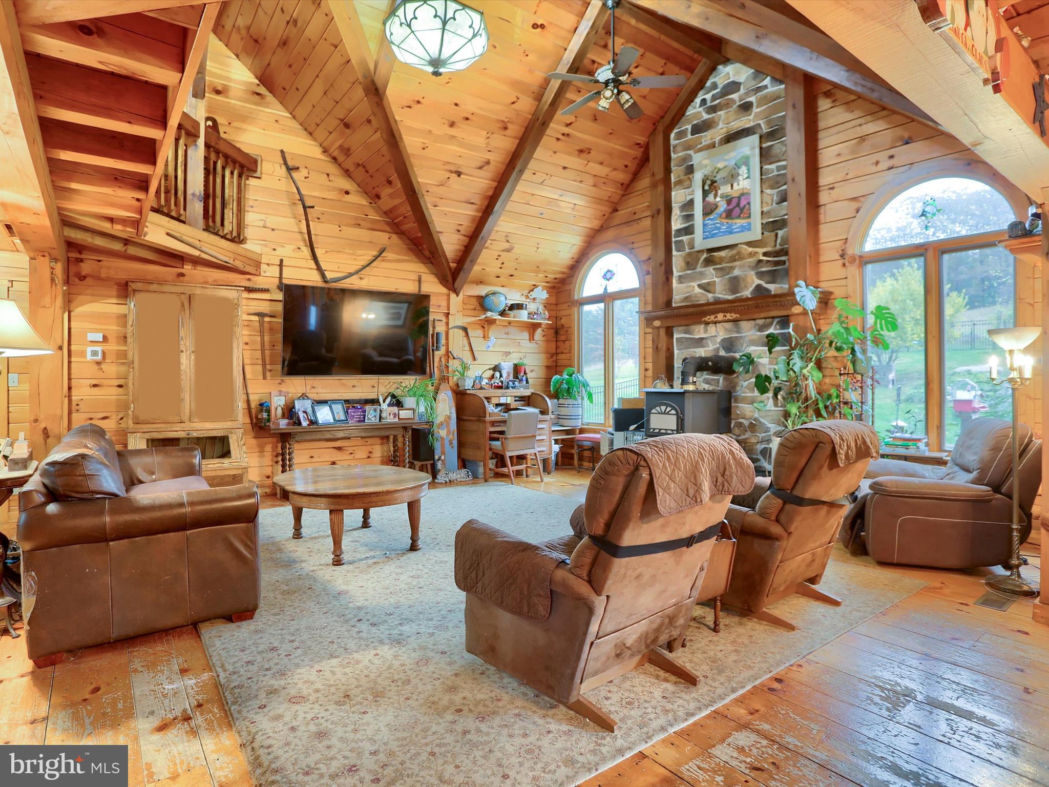 389 Church Road Shermans Dale, PA 17090 - Photo 9 of 85 a living room with fireplace furniture and a flat screen tv