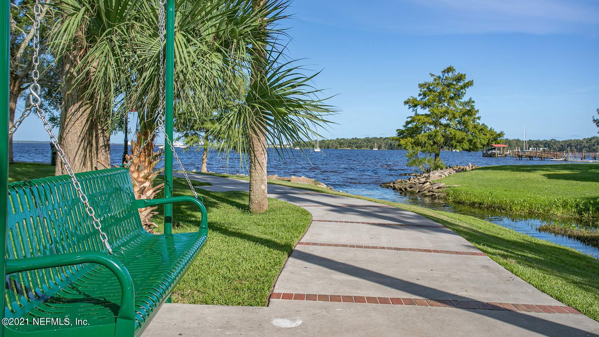 4056 Oak Mill Road Orange Park, FL 32065 - Photo 18 of 24 a view of a yard and palm trees