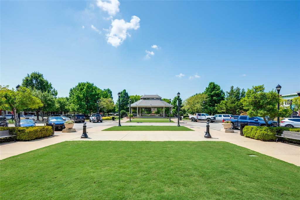 1530 Meeting Street, Unit 1203 Southlake, TX 76092 - Photo 17 of 40 a view of a swimming pool and trees in the background