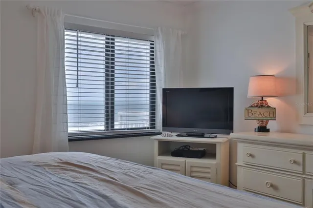 a room with furniture and flat screen tv