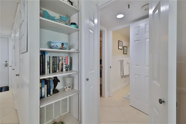 a view of a hallway with shelves