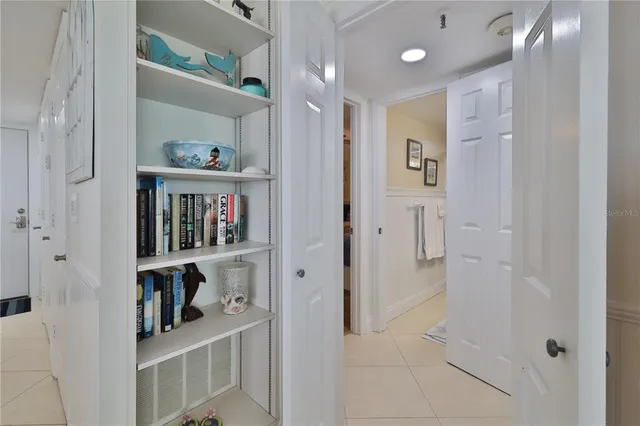 a view of a hallway with shelves