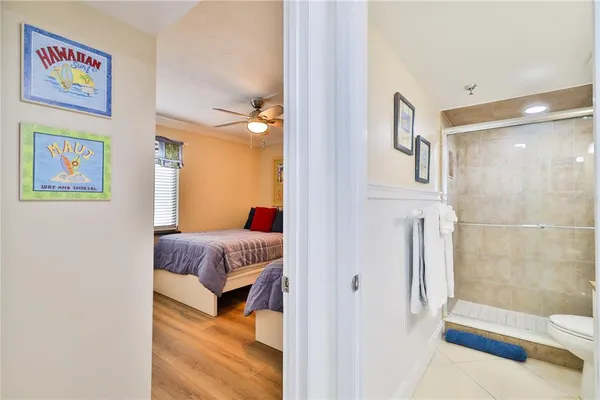 a en suite bathroom with a bathtub and a shower