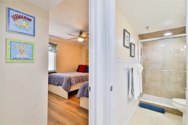 a en suite bathroom with a bathtub and a shower