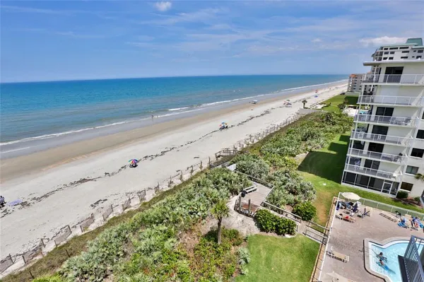 a view of parking area with an ocean view
