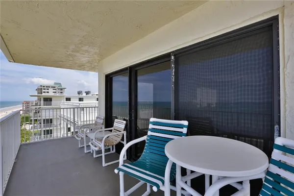 a view of a balcony dining area
