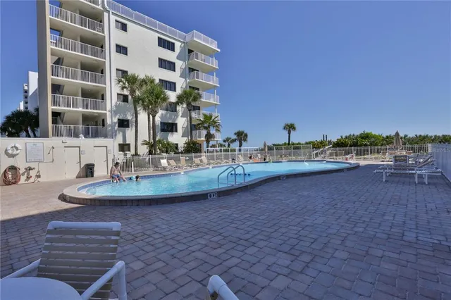 a view of a pool with a yard