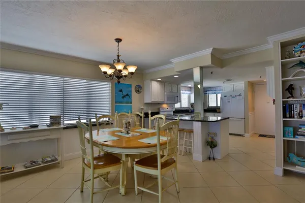 a dining room with a table and chairs