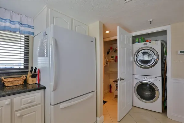 a view of a storage and utility room with washer and dryer