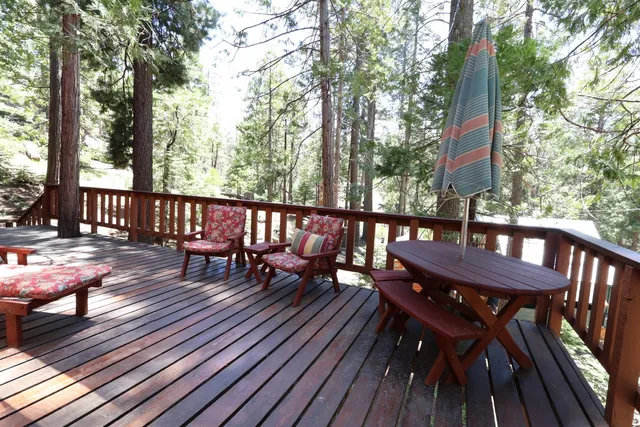 a view of a two chairs and table on the wooden floor