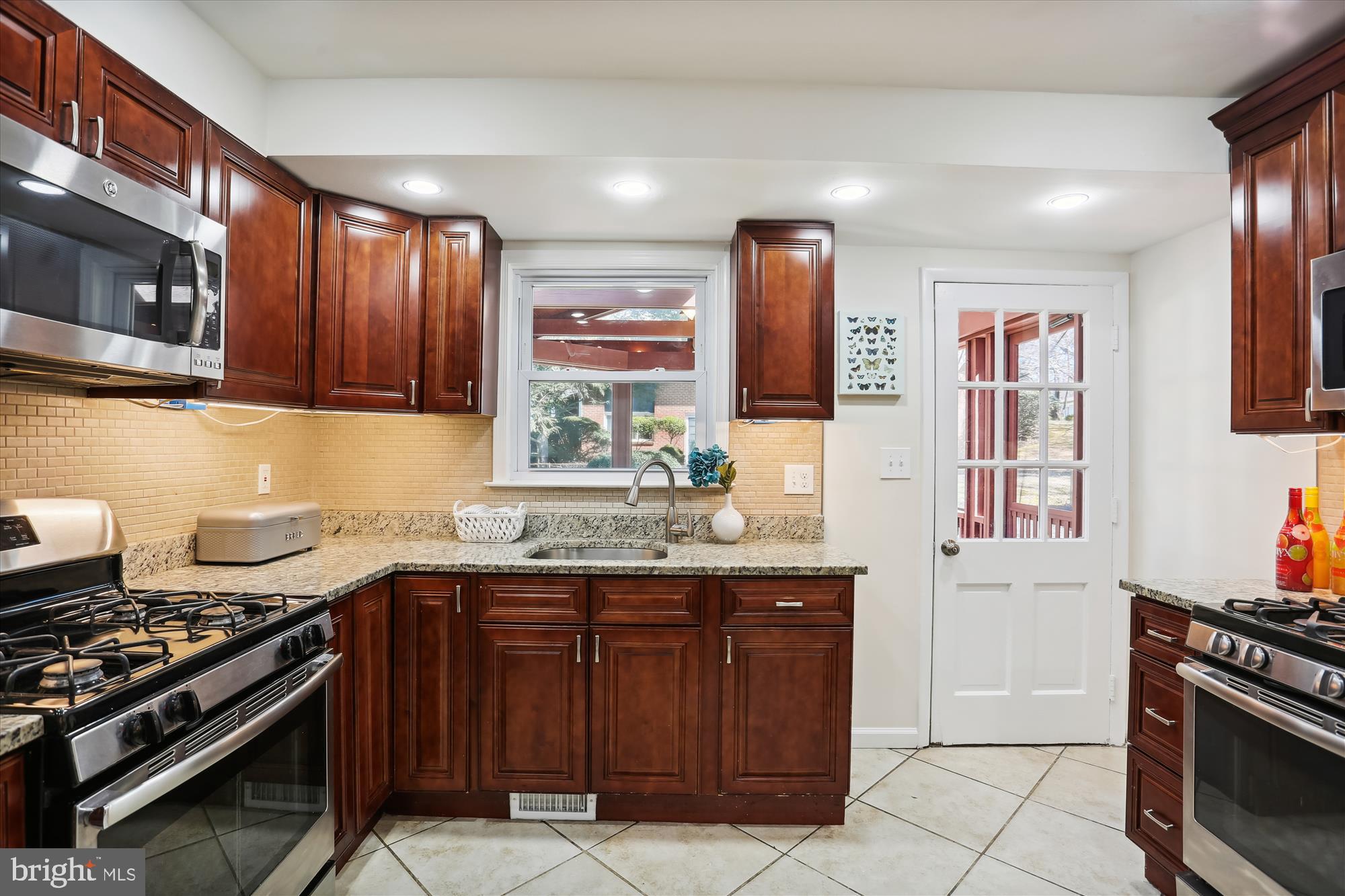 10807 Meadowhill Road Silver Spring, MD 20901 - Photo 14 of 42 Kitchen w/ 2 Ovens + 2 Sinks, Door to Deck