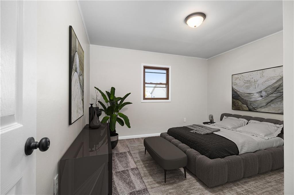 2706 Front Street Monaca, PA 15061 - Photo 13 of 31 a bedroom with furniture and a potted plant