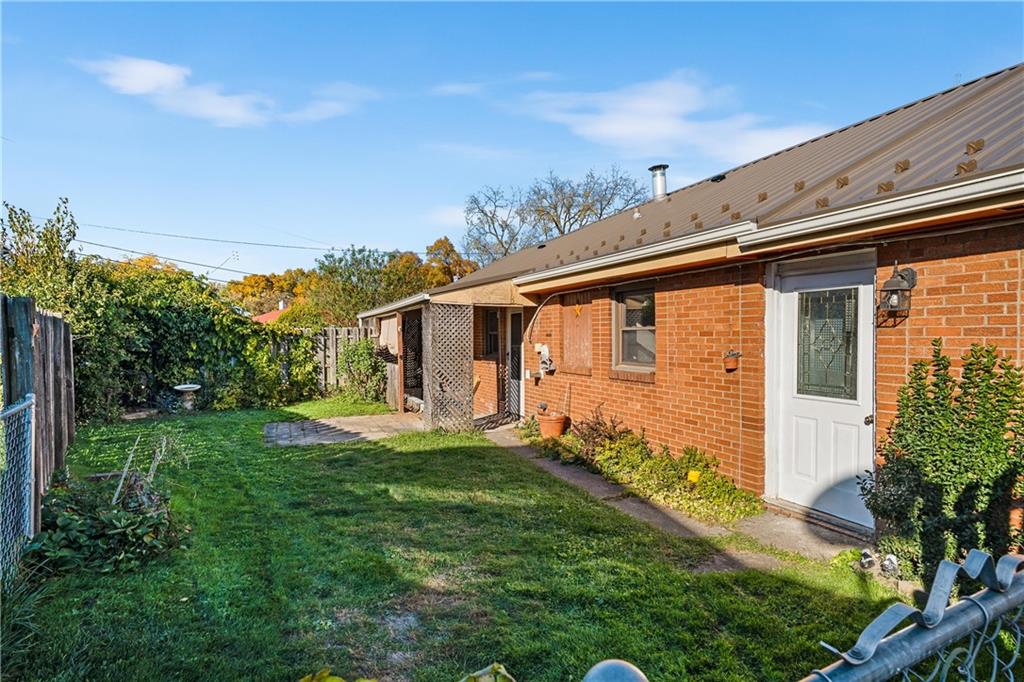 2706 Front Street Monaca, PA 15061 - Photo 20 of 31 a front view of a house with garden