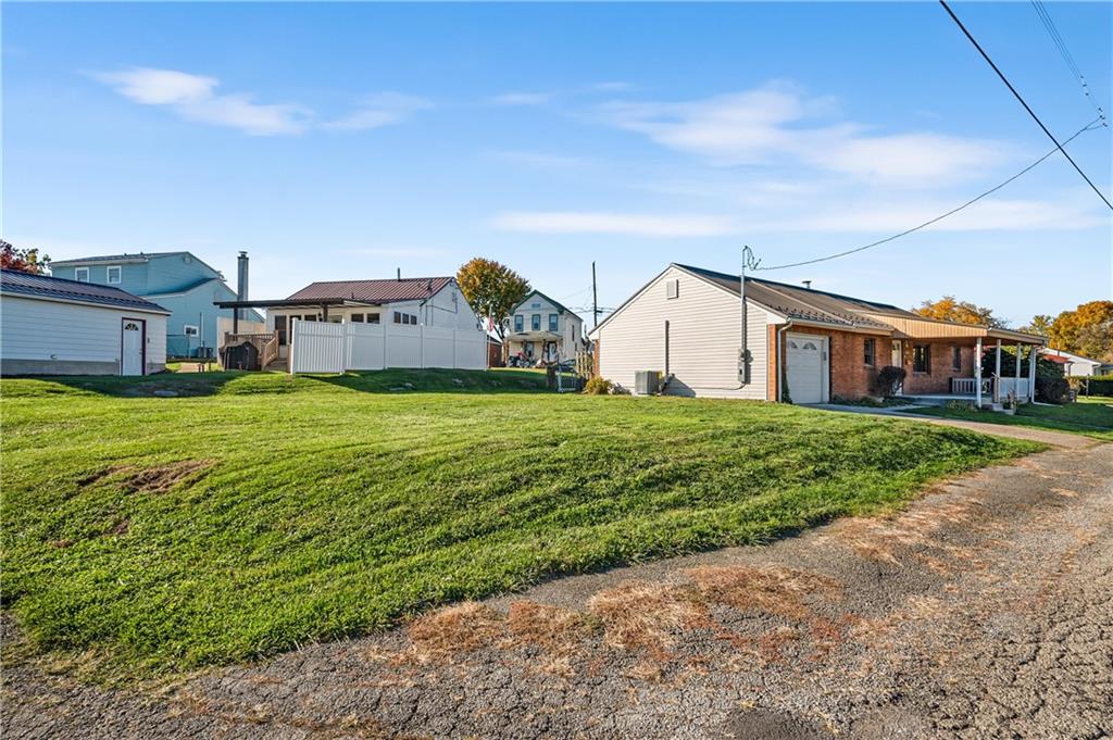2706 Front Street Monaca, PA 15061 - Photo 23 of 31 a view of a house with a big yard and large trees