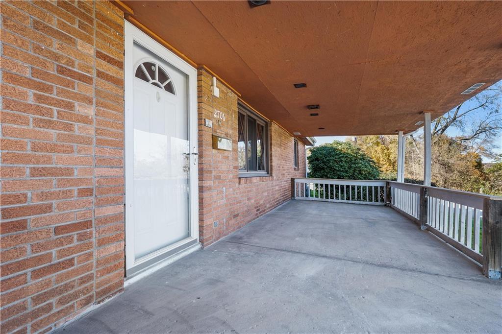 2706 Front Street Monaca, PA 15061 - Photo 29 of 31 a view of a porch with wooden floor and iron fence