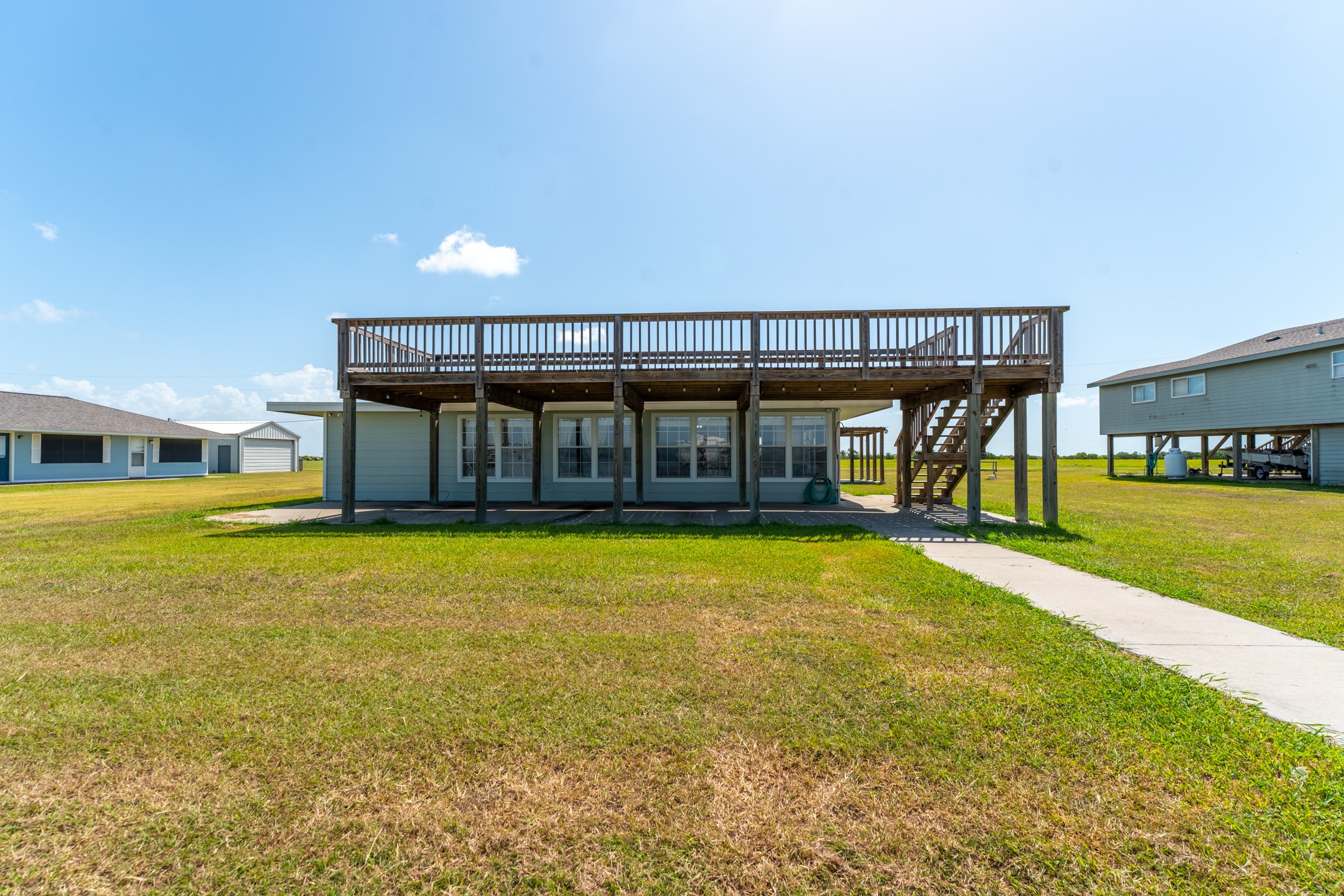 234 El Campo Beach Road Palacios, TX 77465 - Photo 4 of 25 a view of a swimming pool with an outdoor seating