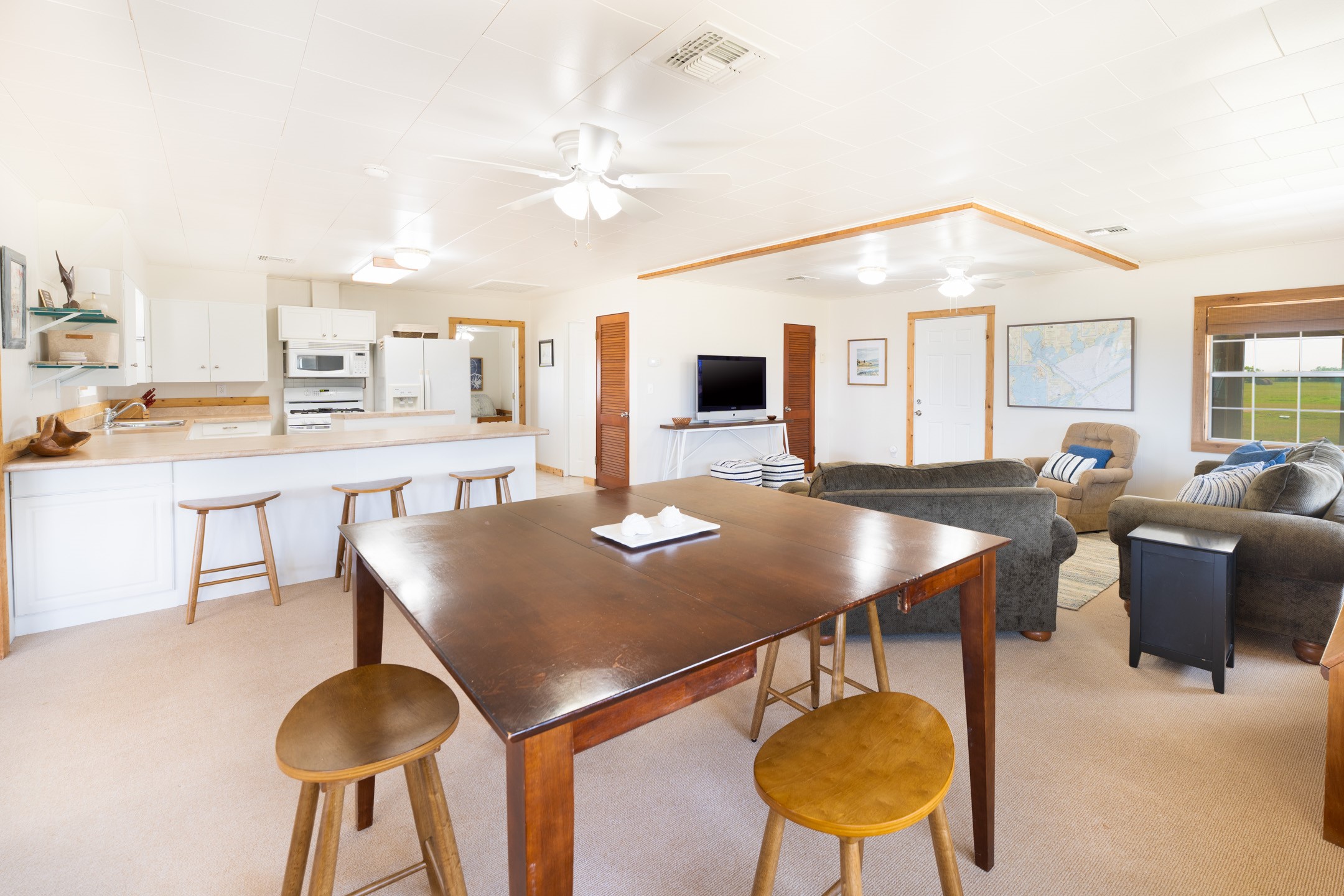 234 El Campo Beach Road Palacios, TX 77465 - Photo 6 of 25 a view of a dining room with furniture and wooden floor