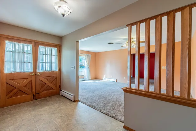 a view of a living room and balcony