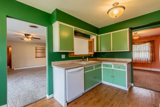 a room with cabinets and wooden floors
