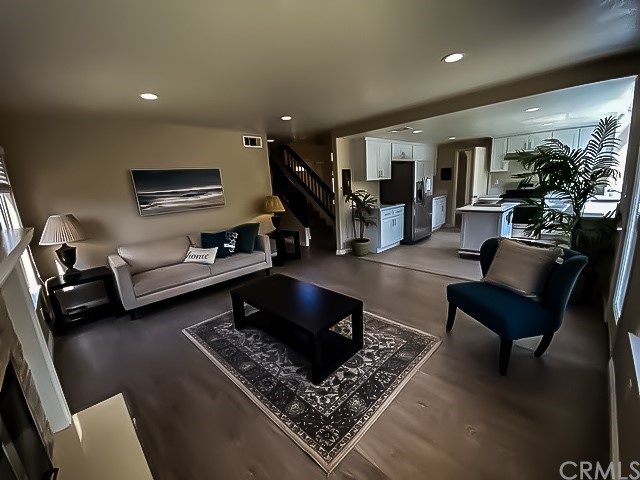 a living room with furniture and a rug
