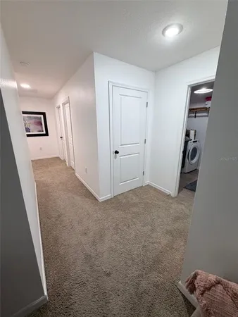a bathroom with a double vanity sink toilet mirror and shower