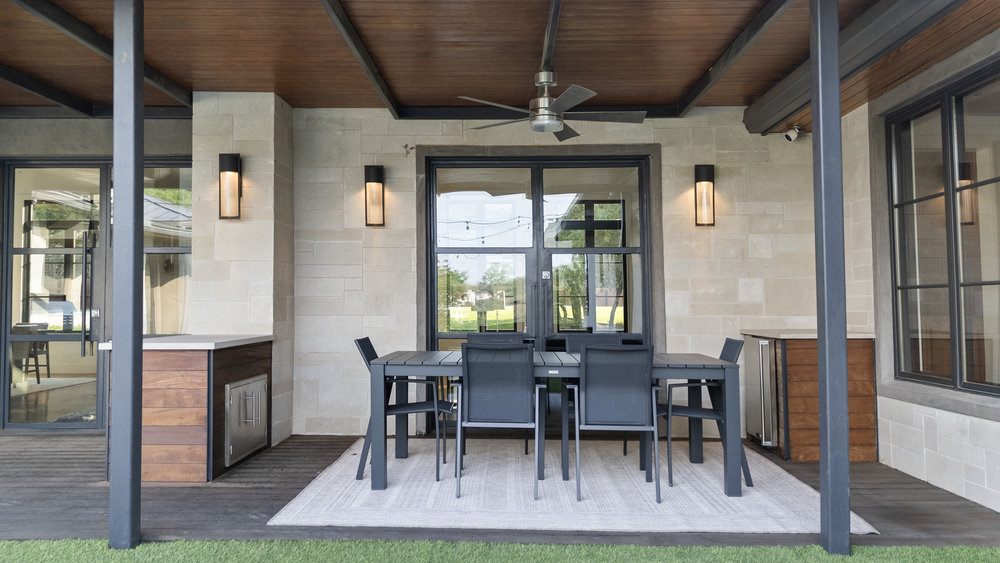 1905 Paisano Road Austin, TX 78746 - Photo 33 of 40 An inviting covered patio offers ample space for outdoor dining and entertainment.