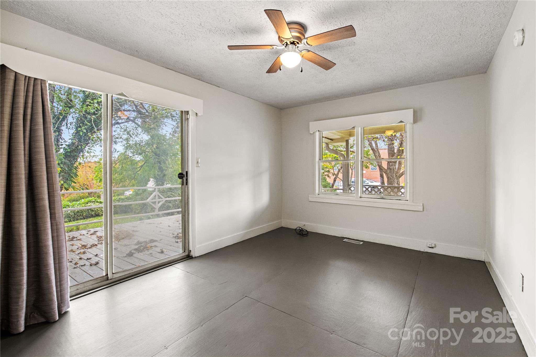 29 Le-An-Hurst Road Asheville, NC 28803 - Photo 11 of 22 wooden floor in an empty room with a window