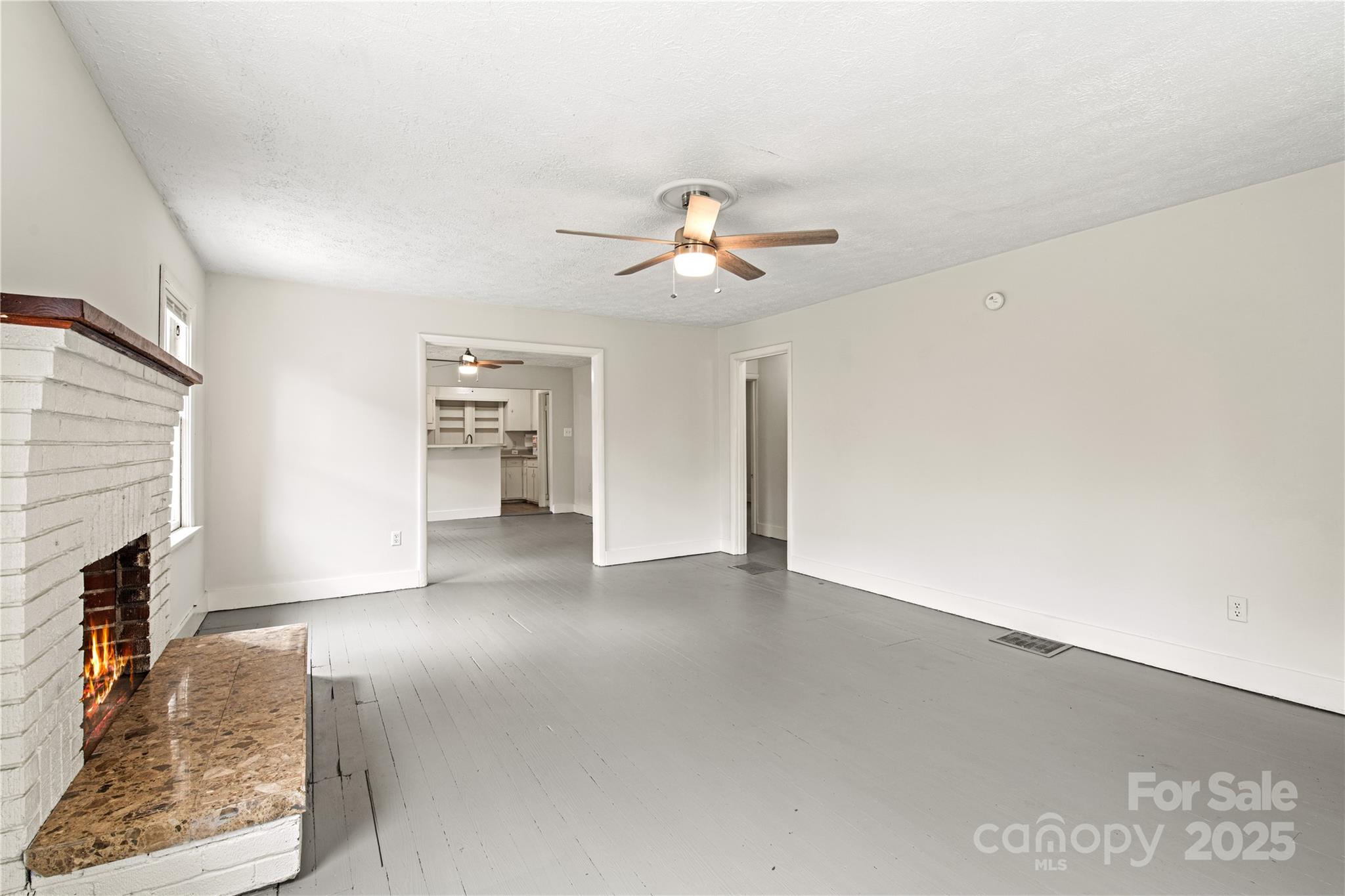 29 Le-An-Hurst Road Asheville, NC 28803 - Photo 5 of 22 a view of an empty room with a fireplace