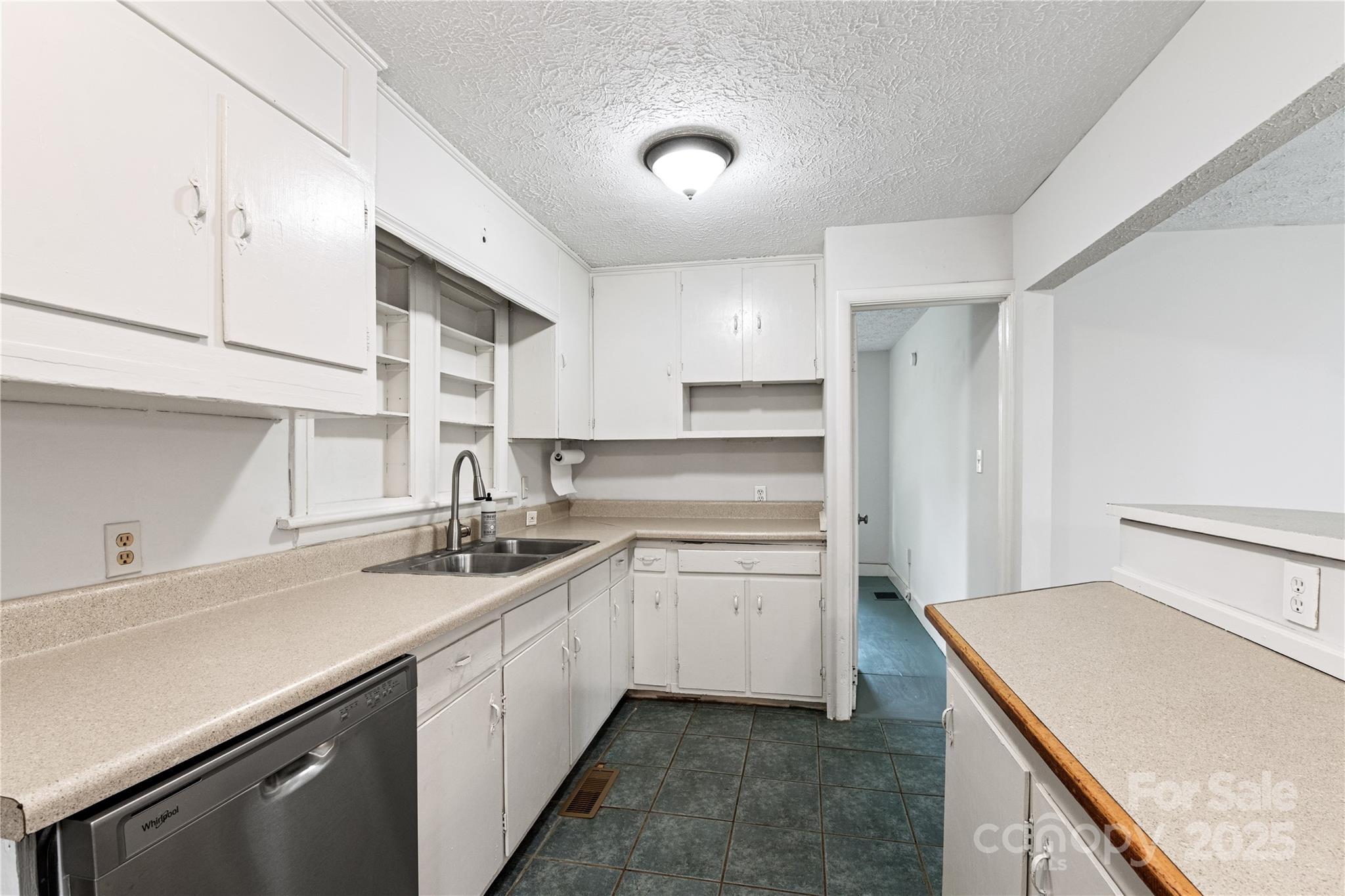 29 Le-An-Hurst Road Asheville, NC 28803 - Photo 9 of 22 a kitchen with a sink stove and cabinets