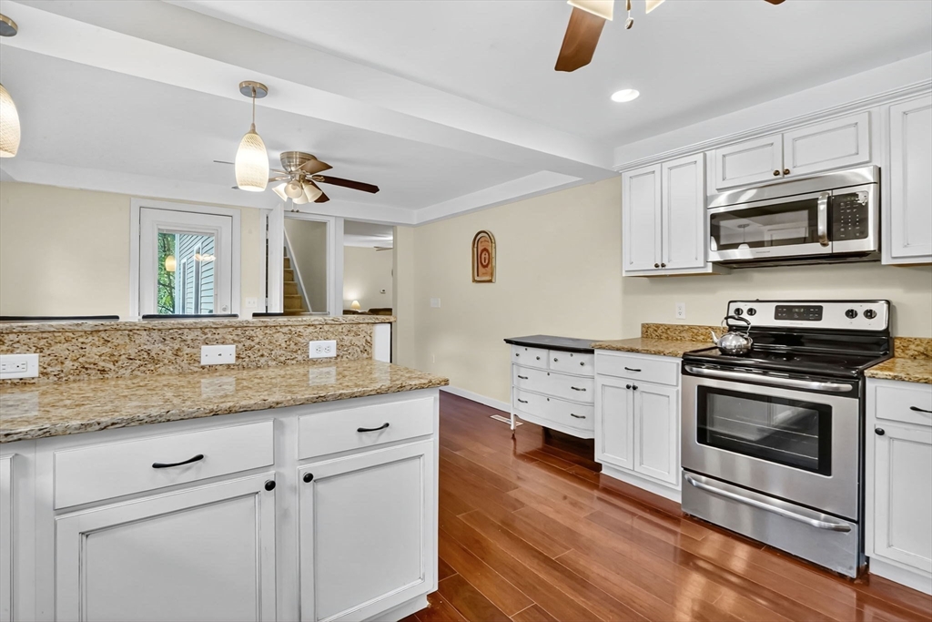 407 Monson Road Wilbraham, MA 01095 - Photo 14 of 38 a kitchen with stainless steel appliances granite countertop a stove and a sink