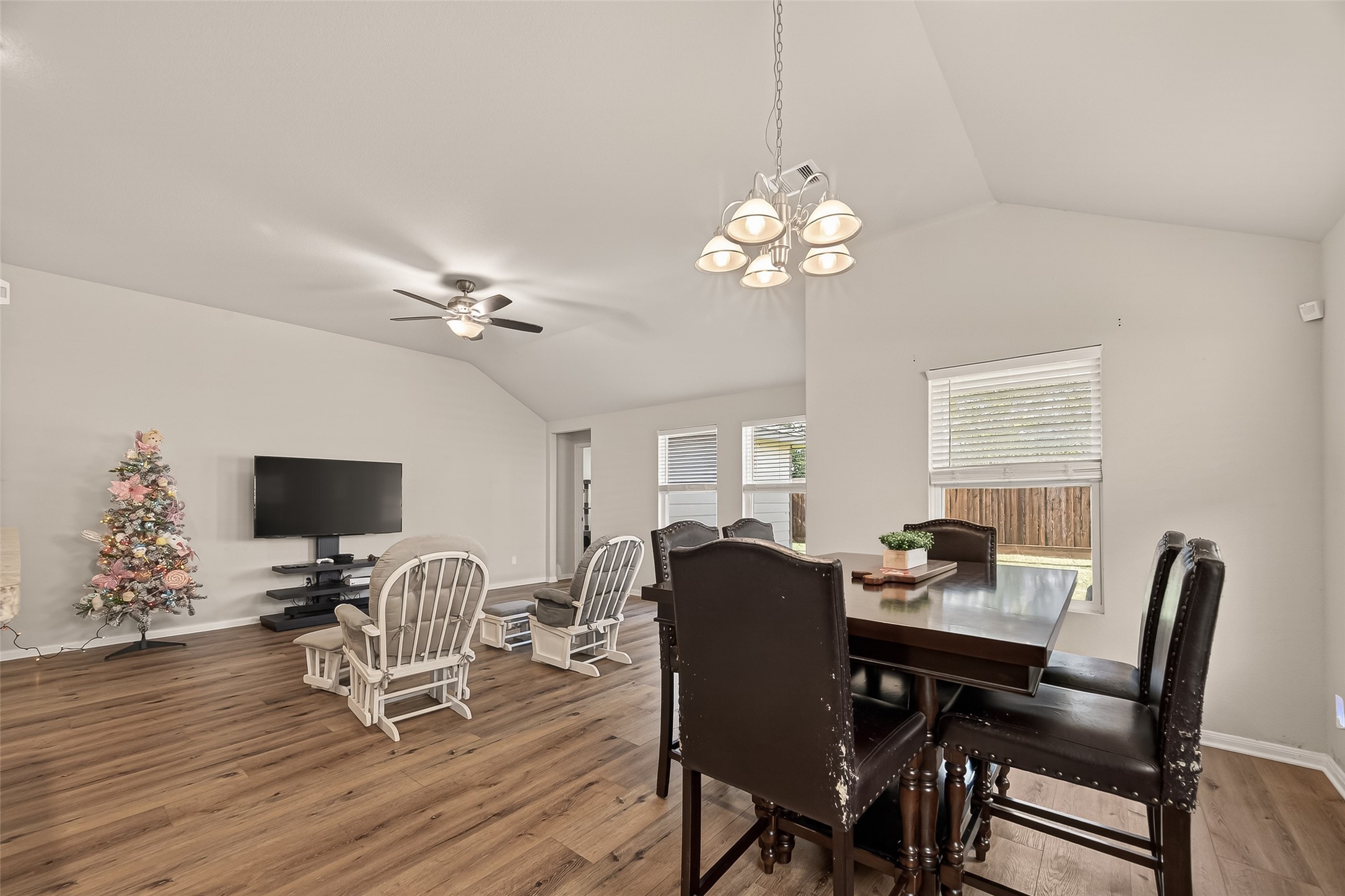 11311 Cascading Stream Way Houston, TX 77044 - Photo 14 of 33 a view of a dining room with furniture wooden floor and chandelier