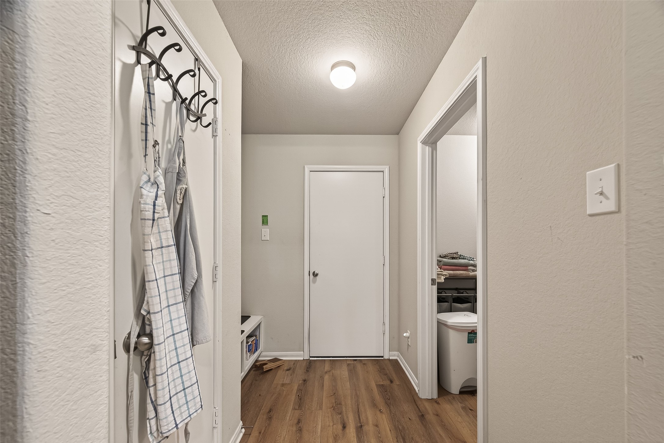 11311 Cascading Stream Way Houston, TX 77044 - Photo 23 of 33 a view of hallway with wooden floor