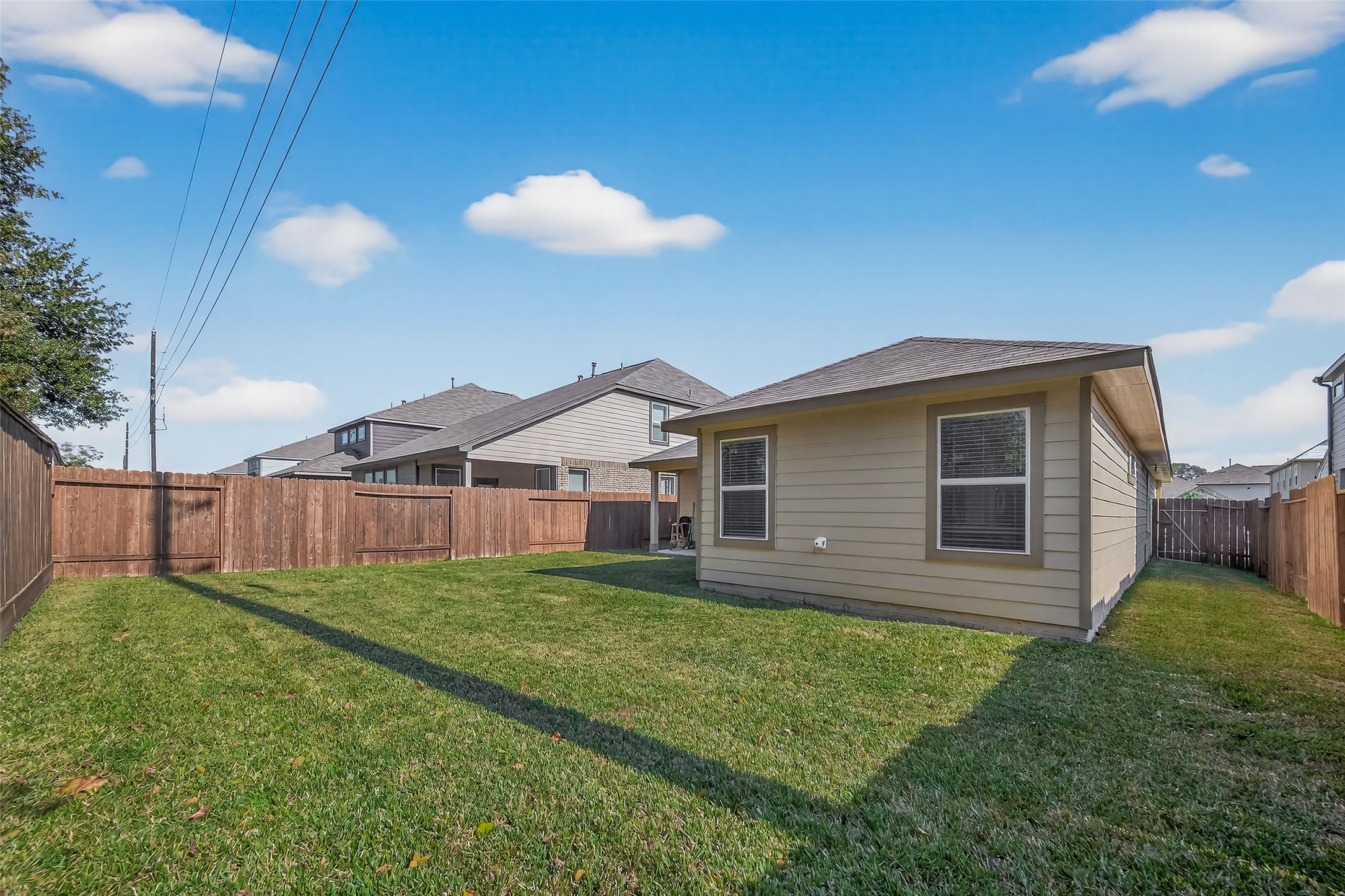 11311 Cascading Stream Way Houston, TX 77044 - Photo 31 of 33 a view of a house with a yard and potted plants