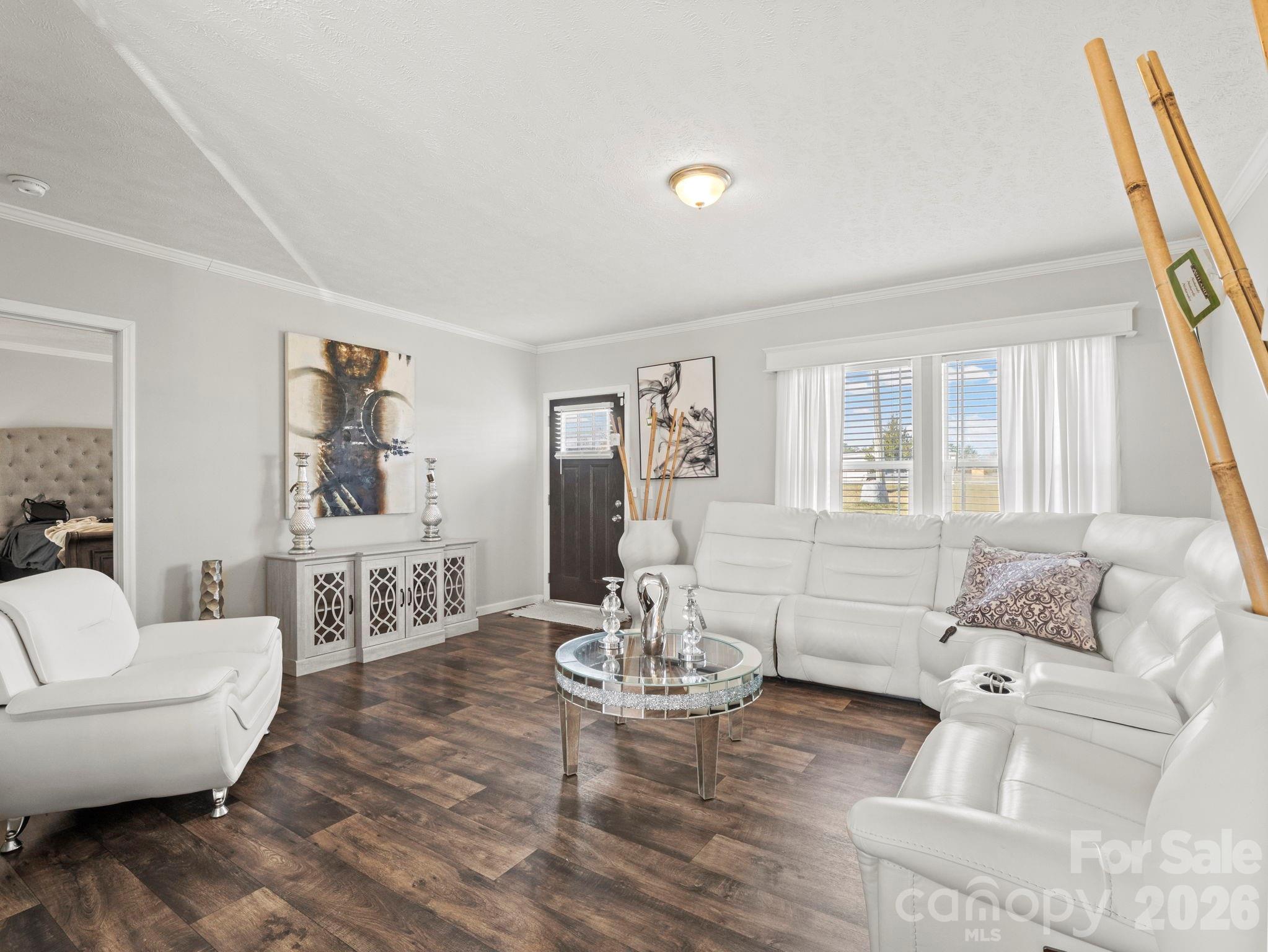 1796 Pilot Mountain Road Hendersonville, NC 28792 - Photo 11 of 26 a living room with furniture and wooden floor