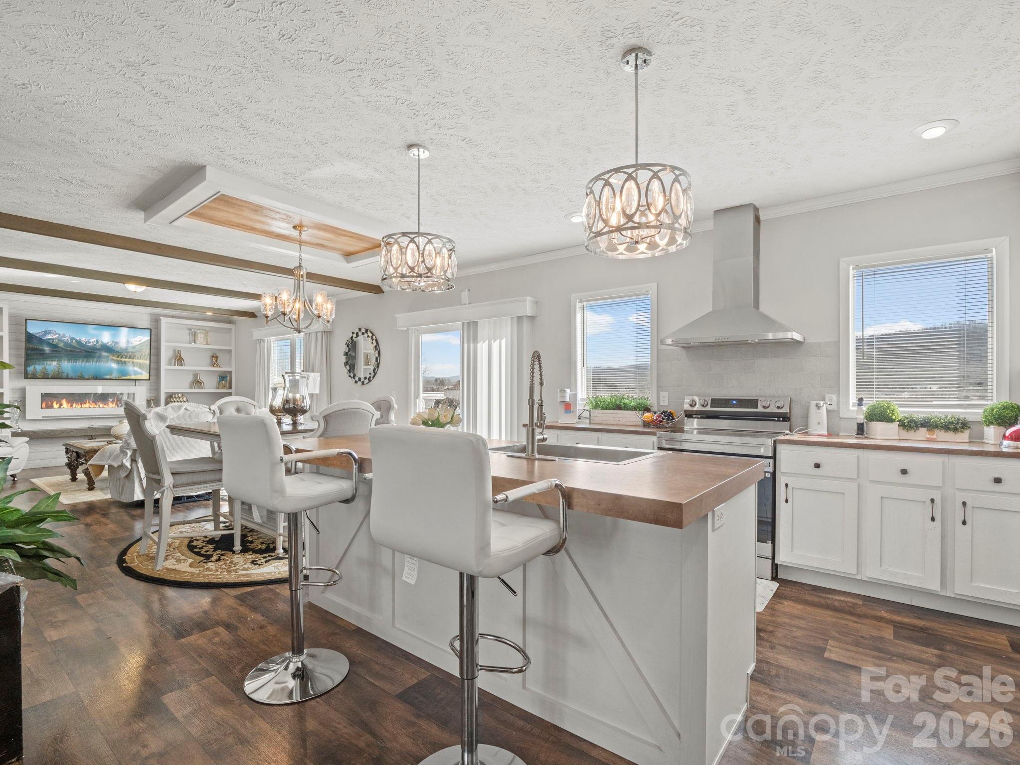1796 Pilot Mountain Road Hendersonville, NC 28792 - Photo 13 of 26 a view of a dining room with furniture wooden floor and chandelier