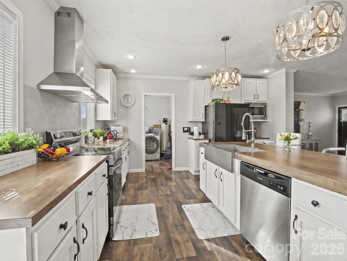1796 Pilot Mountain Road Hendersonville, NC 28792 - Photo 14 of 26 a kitchen with a sink counter top space and stainless steel appliances