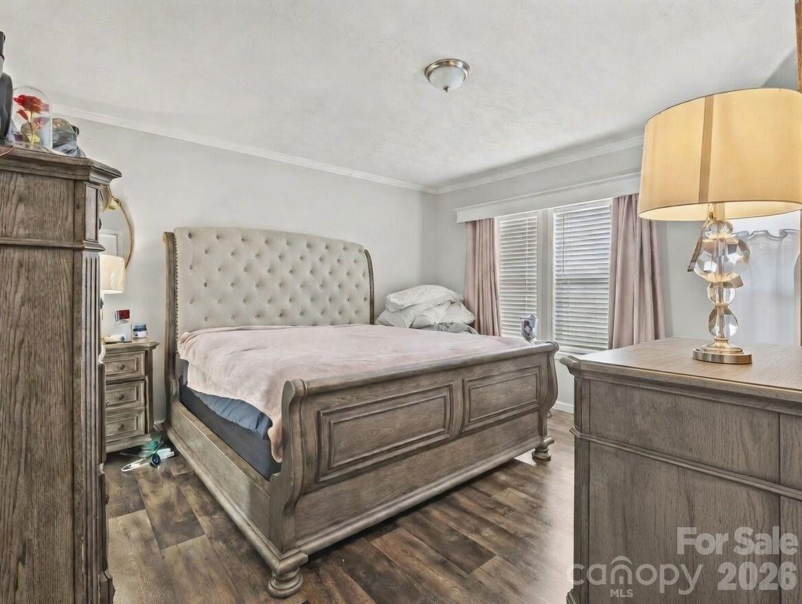 1796 Pilot Mountain Road Hendersonville, NC 28792 - Photo 22 of 26 a bedroom with a bed and a dresser