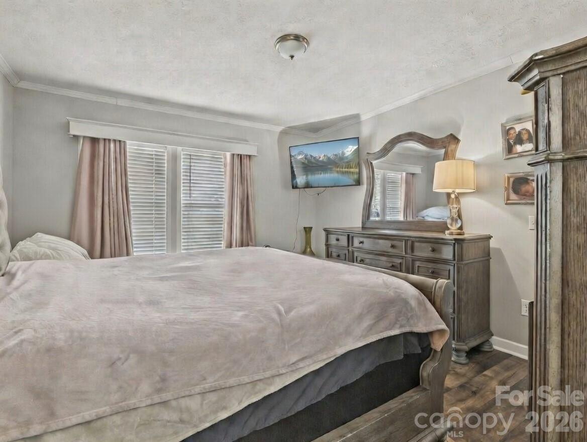 1796 Pilot Mountain Road Hendersonville, NC 28792 - Photo 23 of 26 a bedroom with a bed and a table