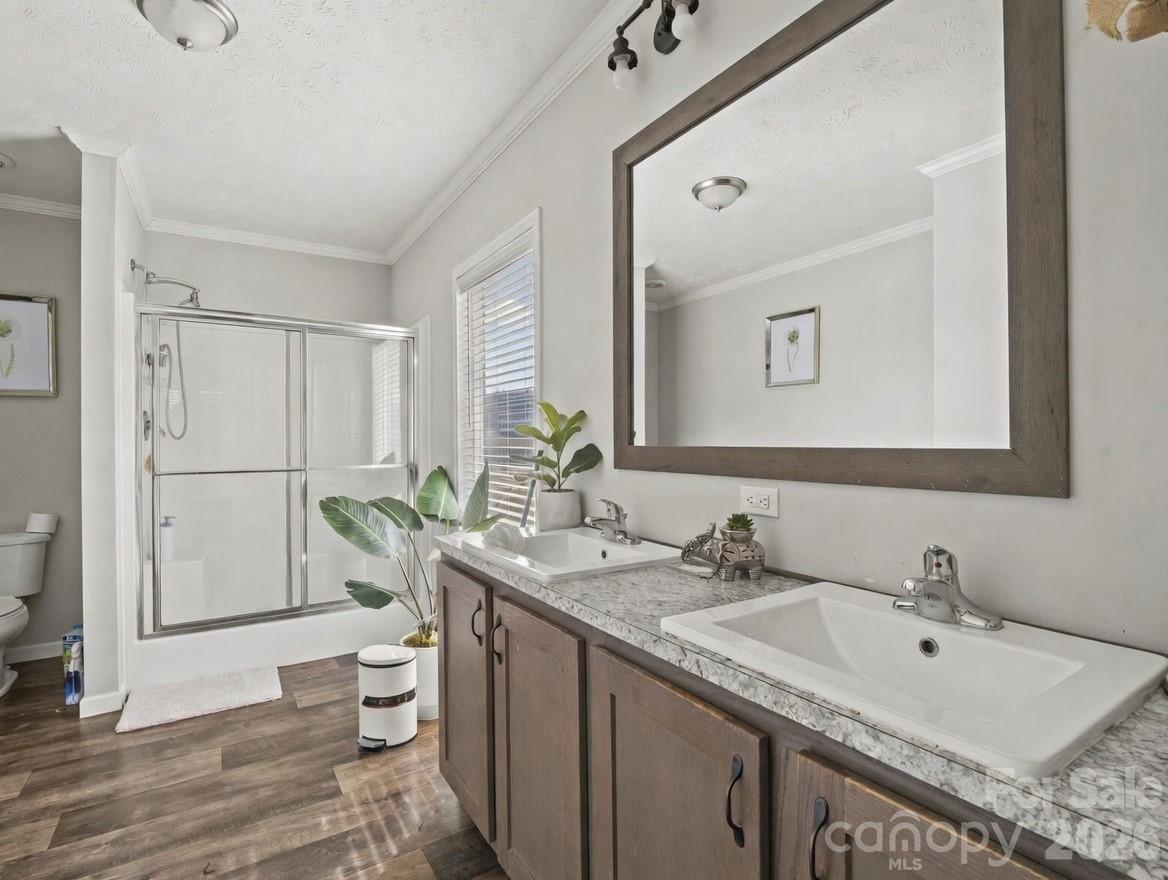 1796 Pilot Mountain Road Hendersonville, NC 28792 - Photo 26 of 26 a bathroom with a granite countertop sink and a mirror
