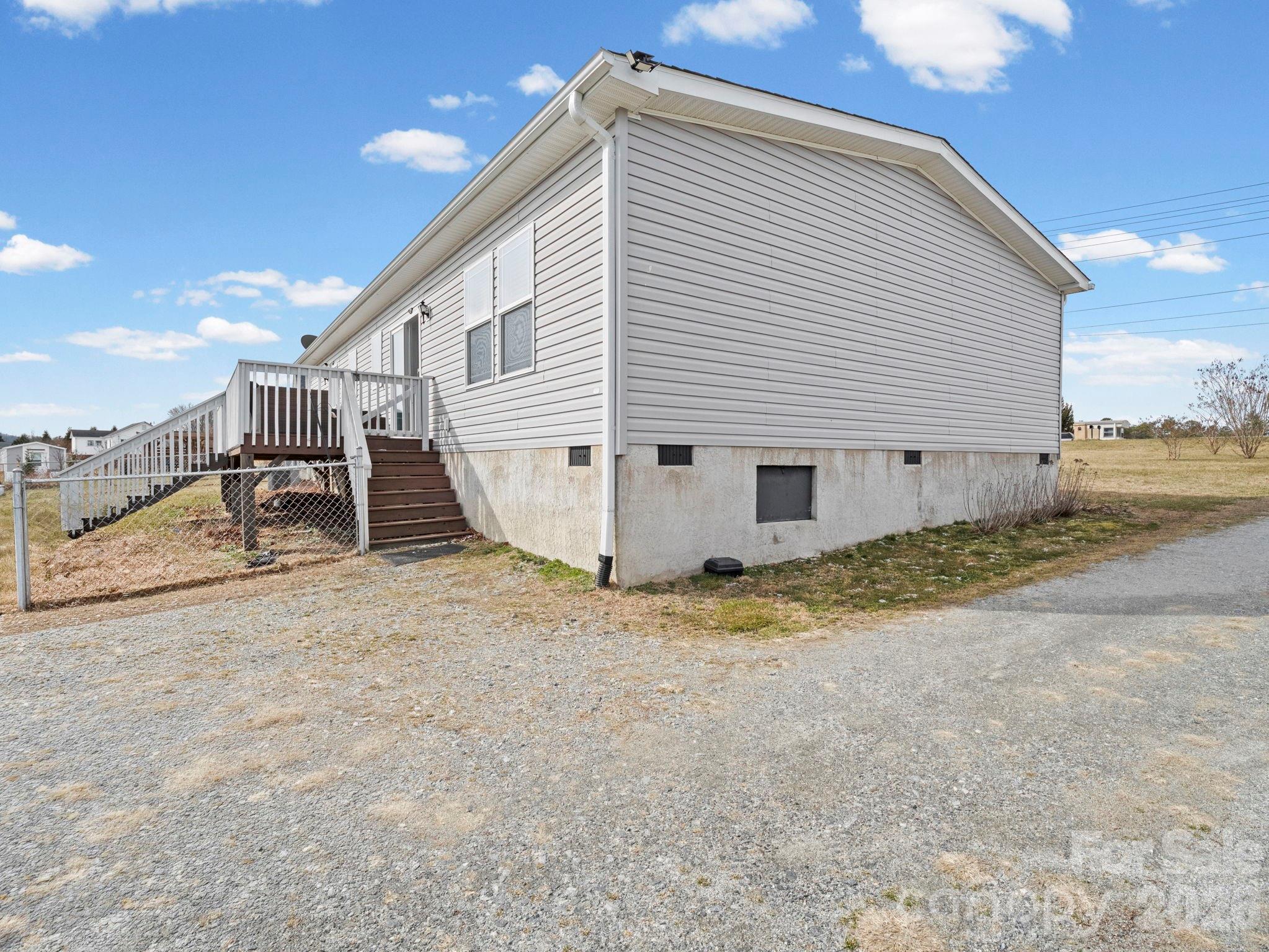 1796 Pilot Mountain Road Hendersonville, NC 28792 - Photo 4 of 26 a view of a house with a backyard