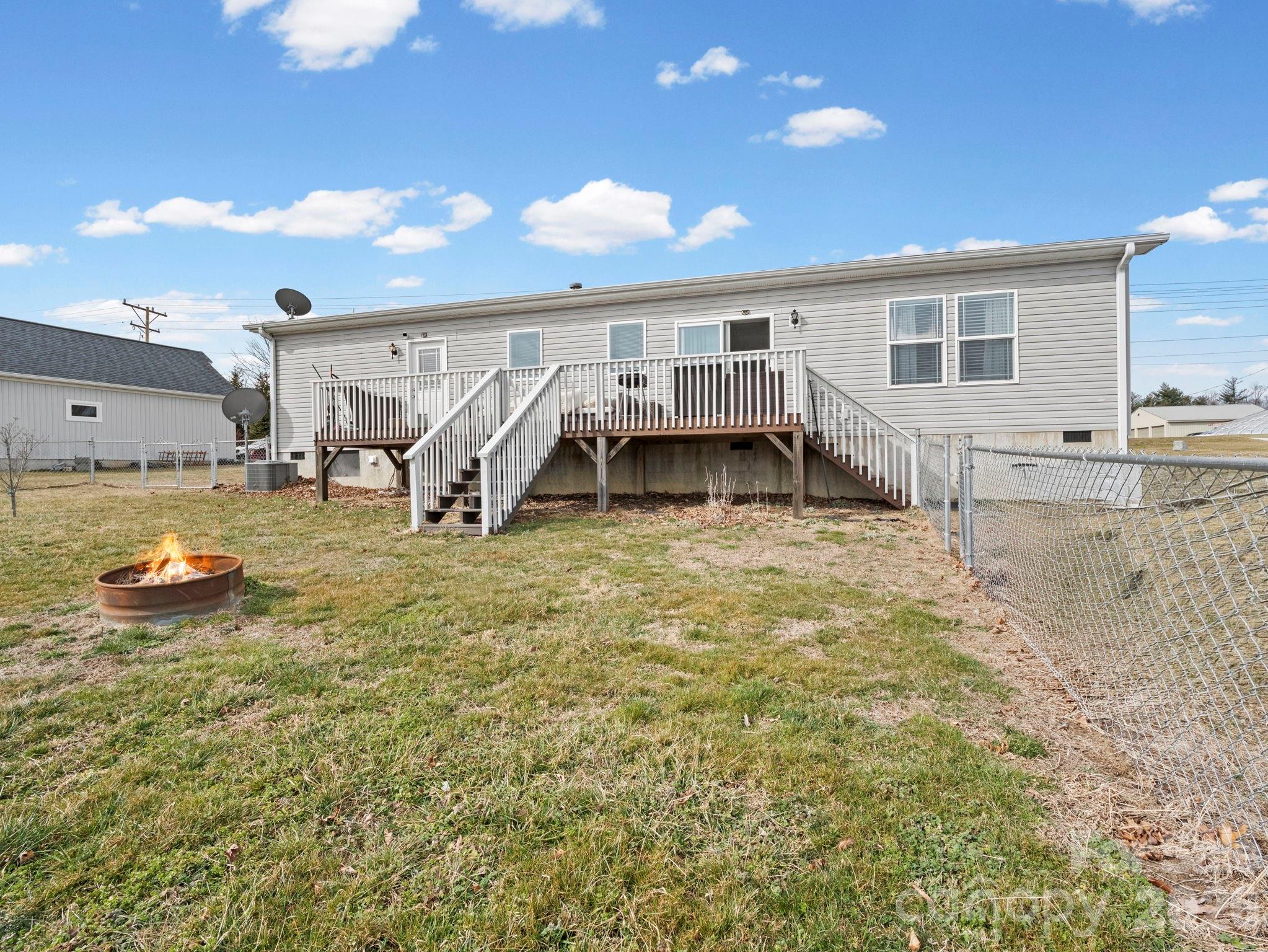 1796 Pilot Mountain Road Hendersonville, NC 28792 - Photo 5 of 26 a view of a house with a yard and sitting area