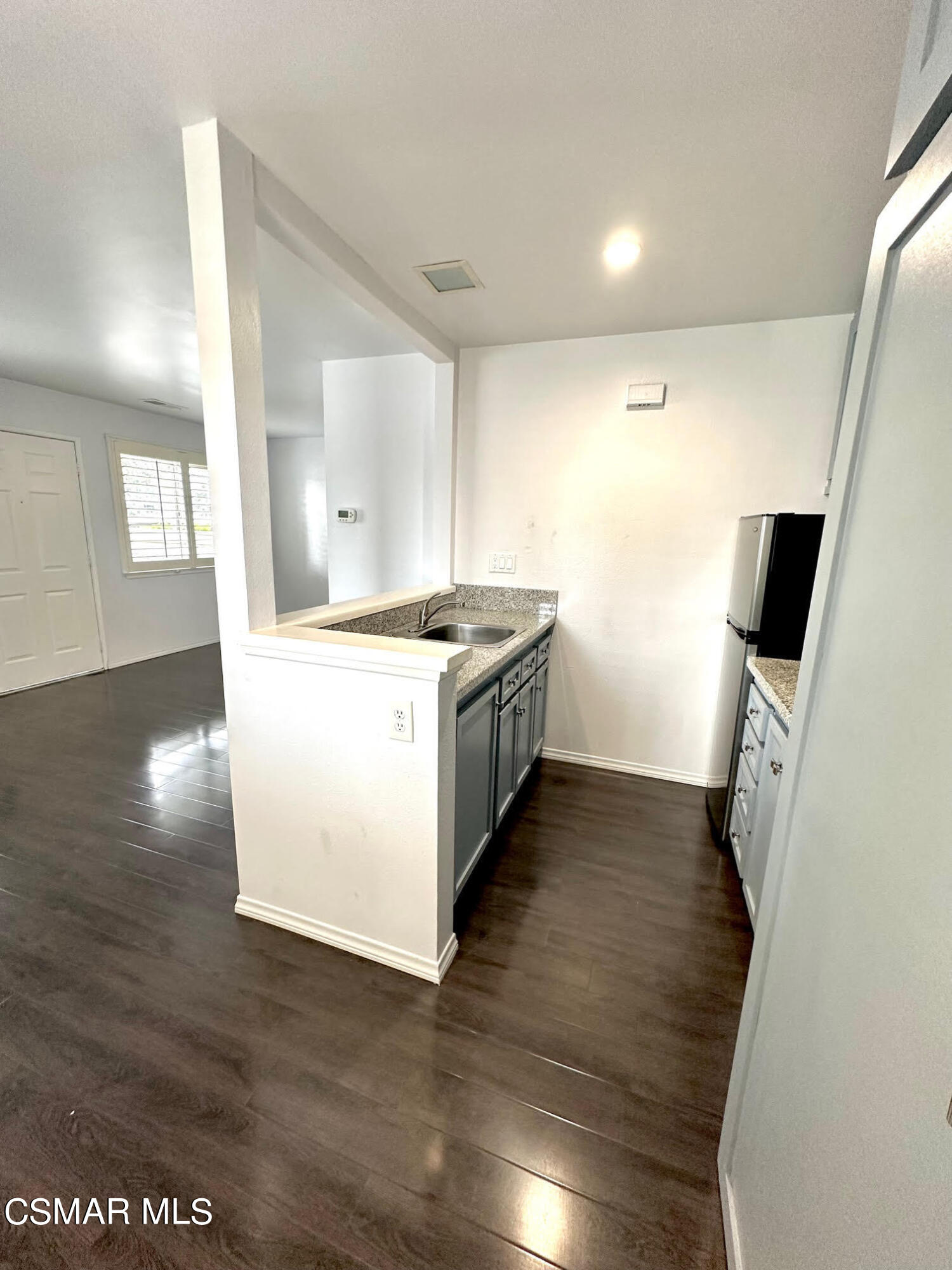 4541 Alamo Street, Unit A Simi Valley, CA 93063 - Photo 15 of 20 a kitchen with a sink and wooden floor