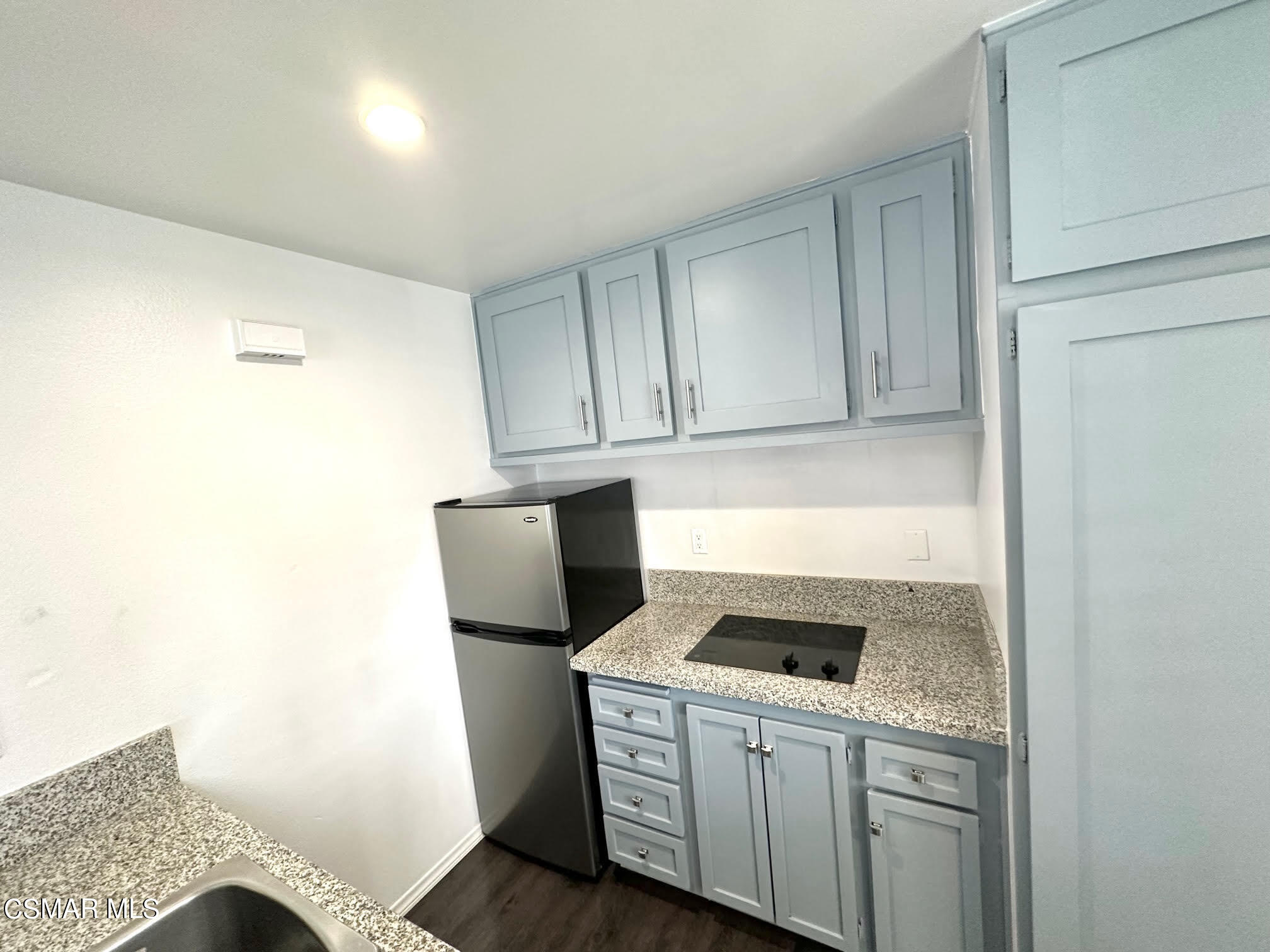 4541 Alamo Street, Unit A Simi Valley, CA 93063 - Photo 17 of 20 a kitchen with a stove and a refrigerator