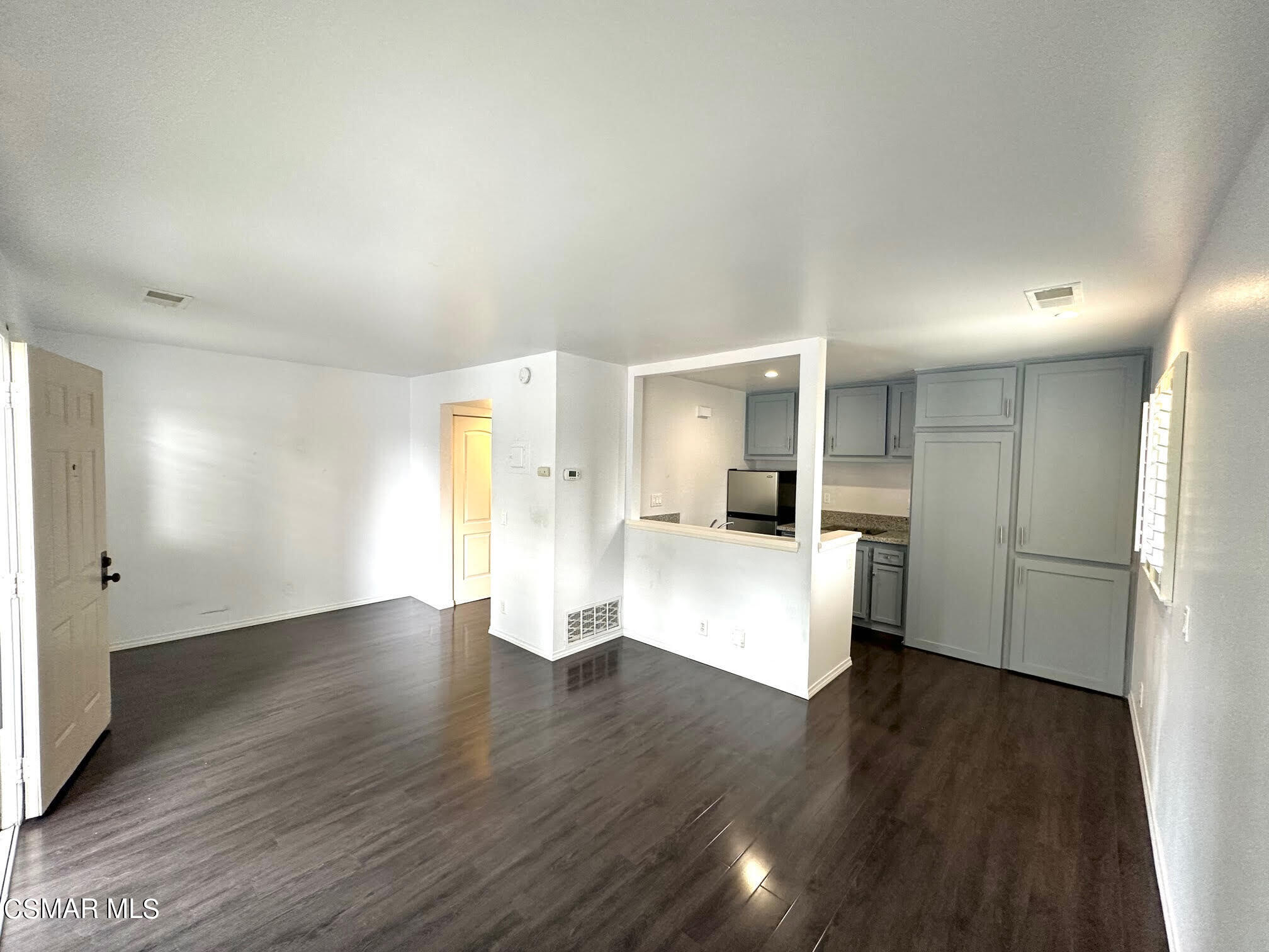 4541 Alamo Street, Unit A Simi Valley, CA 93063 - Photo 19 of 20 a view of a kitchen with a refrigerator and a stove